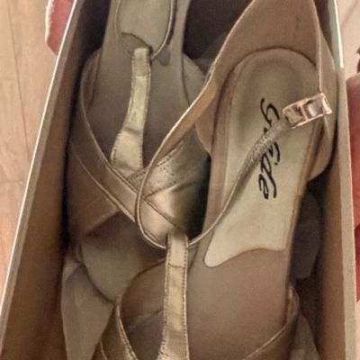 Sale Photo Thumbnail #36: Pair of Glide brand metallic gold t-strap dance shoes with ankle buckles, presented in their original box.