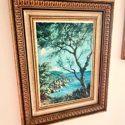 Sale Photo Thumbnail #38: Vintage oil painting depicting a coastal landscape with a prominent tree, housed in an ornate, gilded wood frame with a linen liner.