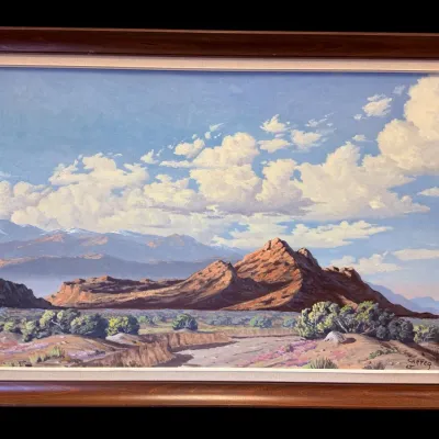 Sale Photo Thumbnail #58: Framed oil on canvas landscape painting depicting a desert mountain scene under a cloudy sky, signed 'Carter 65' in the lower right corner.