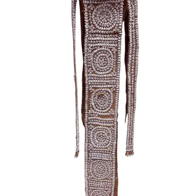 Sale Photo Thumbnail #42: Vintage African tribal leather sash adorned with intricate cowrie shell embroidery in circular and linear patterns.