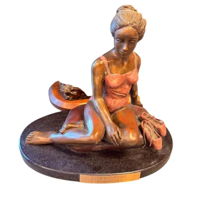 Sale Photo Thumbnail #3: Bronze sculpture titled "Contemplations" by Yvonne Lavalle, depicting a seated ballerina in a pink leotard with her ballet slippers beside her, mounted on a dark stone base.
