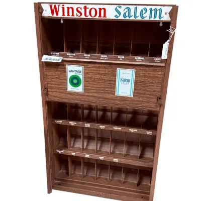 Sale Photo Thumbnail #53: Vintage Winston and Salem wooden cigarette display rack, featuring multiple slots for various brands including Vantage and Camel.