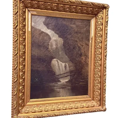 Sale Photo Thumbnail #11: Antique oil painting depicting a waterfall landscape, housed in an ornate, heavily carved giltwood frame.