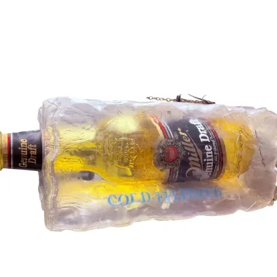 Sale Photo Thumbnail #54: Vintage Miller Genuine Draft beer advertising sign, featuring a bottle encased in a faux block of ice with "Cold-Filtered" text.