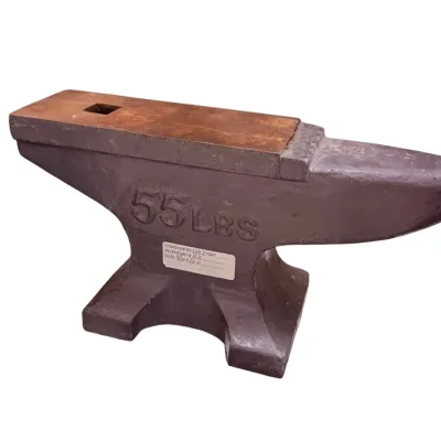 Sale Photo Thumbnail #55: Vintage cast iron blacksmith anvil weighing 55 lbs, featuring a flat face with a hardy hole and a tapered horn.