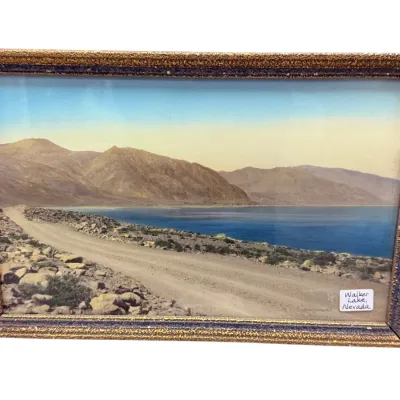 Sale Photo Thumbnail #52: Vintage hand-colored photograph of Walker Lake, Nevada, housed in a textured gilt and blue frame.