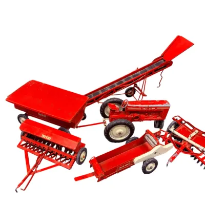 Sale Photo Thumbnail #29: Vintage Tru-Scale pressed steel toy tractor and farm implement set, showing some paint wear and play-worn patina.