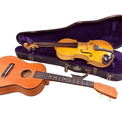 Sale Photo Thumbnail #44: Vintage violin with a purple velvet-lined hard case, paired with a classic wooden ukulele.