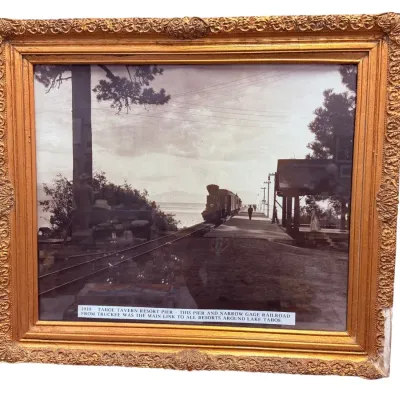 Sale Photo Thumbnail #40: Framed historical photograph depicting the 1910 Tahoe Tavern Resort Pier and narrow-gauge railroad, housed in an ornate, gilded wood frame.