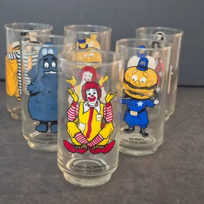 Set of six vintage McDonald's Collector Series drinking glasses from 1977, featuring characters like Ronald McDonald, Grimace, and...