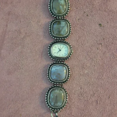 Vintage silver-tone link watch featuring four large, polished agate stone cabochons in beaded bezels flanking a central quartz watch face.