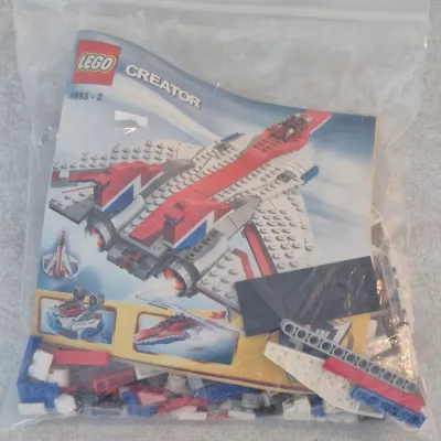 Lego Creator 3-in-1 Fast Flyers set 4953, packaged in a clear plastic bag with the original instruction manual.