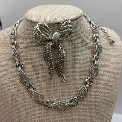 Silver Tone Art Deco Style Necklace 16" and Monet Bow Pin 