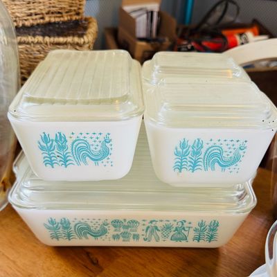 Sale Photo Thumbnail #52: Vintage Pyrex Butterprint pattern refrigerator dish set, featuring turquoise farm scenes on white milk glass with clear ribbed glass lids.