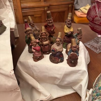 Sale Photo Thumbnail #58: Collection of vintage Cairn Studio Tom Clark gnome figurines, each wearing a thimble hat and holding sewing notions.