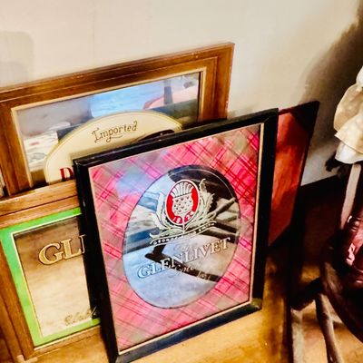 Sale Photo Thumbnail #16: Vintage framed advertising mirrors, including a Glenlivet Scotch Whisky mirror with a red plaid background and a Grolsch beer mirror.
