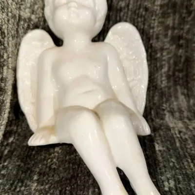 Vintage White Ceramic Cherub Angel Shelf Sitter, Glossy Glazed Porcelain, Dangling Legs.