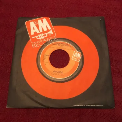 Double – “The Captain of Her Heart” / “Your Prayer Takes Me Off Part II (Dub)” – A&M AM-2838, 45 RPM