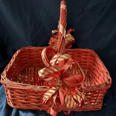 Festive Red Wicker Gift Basket with Decorative Ribbon Bows