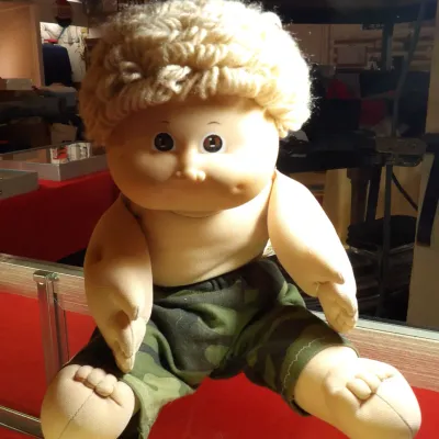 Sale Photo Thumbnail #4: Vintage Cabbage Patch Kids doll by Coleco, featuring blonde yarn hair and camouflage pants, circa 1980s.