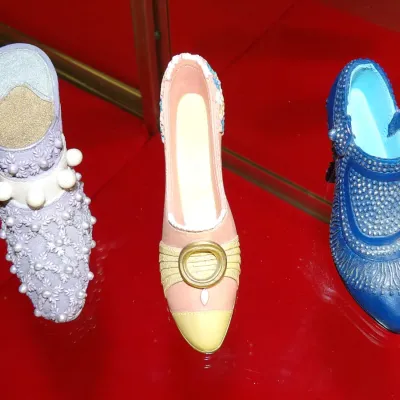 Sale Photo Thumbnail #24: Three Just the Right Shoe miniature collectible figurines by Raine, featuring a lavender beaded mule, a pink and yellow buckled pump, and a textured blue high-heeled bootie.
