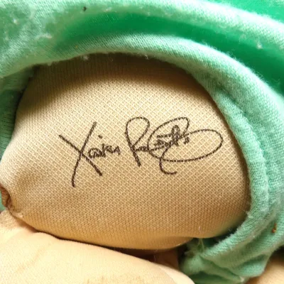 Sale Photo Thumbnail #7: Vintage Cabbage Patch Kids doll featuring the signature of creator Xavier Roberts printed on the rear, showing some light wear on the fabric.
