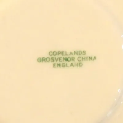 Sale Photo Thumbnail #43: Green maker's mark on the underside of a ceramic piece, reading "Copelands Grosvenor China England."