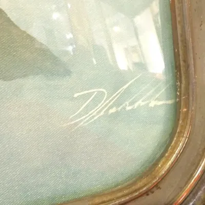 Sale Photo Thumbnail #39: Close-up detail of artist's signature on a framed, glazed print, showing a stylized white signature in the lower right corner.