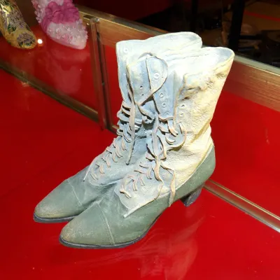 Sale Photo Thumbnail #36: Just the Right Shoe "Grandma's Boots" collectible figurine by Raine, featuring a detailed pair of vintage-style lace-up boots with a weathered green and cream finish.