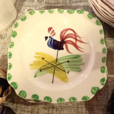 Sale Photo Thumbnail #49: Vintage Stangl Pottery square salad plate in the 'Country Life' pattern, featuring a hand-painted rooster weathervane design with a green scalloped border.