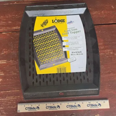 Sale Photo Thumbnail #19: Lodge Seasoned Cast Iron Grill Topper measuring 15 x 12 inches