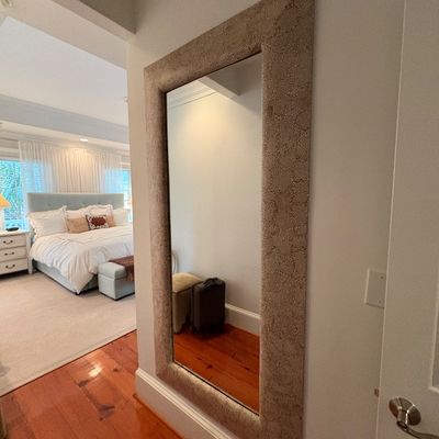 Large contemporary floor-standing or wall-mounted full-length mirror featuring a wide, textured faux-shagreen or pebbled leather frame.