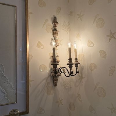 French Country three-light wall sconce with distressed cream and green painted finish and carved acanthus leaf details.