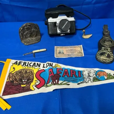 World Traveler Decor incl. Topcon Uni Camera, Pocket Knife, Mozambique Money, Horse Brass, & More