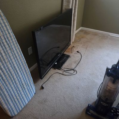 Sale Photo Thumbnail #15: Sony Bravia flat-screen television on a stand, shown with power cord, 