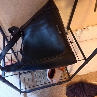 Sale Photo Thumbnail #29: Nakedvice black leather shoulder bag with silver-tone hardware, displayed on a wire shelf.