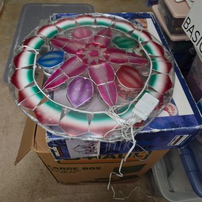 Sale Photo Thumbnail #34: Traditional Filipino Christmas parol star lantern, featuring colorful capiz shell panels in red, green, and purple with integrated electrical wiring.
