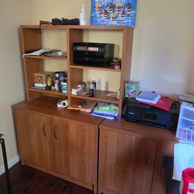 Sale Photo Thumbnail #41: Modern wood laminate office storage unit featuring a two-door cabinet base with a matching hutch, paired with an adjacent two-door storage cabinet.