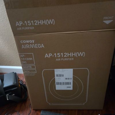 Sale Photo Thumbnail #11: Coway Airmega AP-1512HH(W) air purifier in its original cardboard packaging.