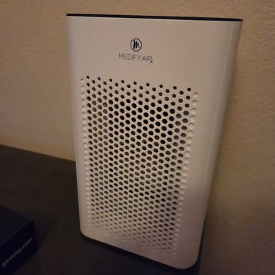 Sale Photo Thumbnail #26: Medify Air MA-14 air purifier in white, featuring a compact design with a perforated front grille.