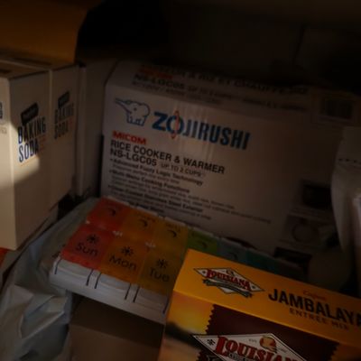 Sale Photo Thumbnail #23: Zojirushi Micom Rice Cooker & Warmer (model NS-LGC05) in its original box, stored in a pantry alongside baking soda, a pill organizer, and jambalaya mix.