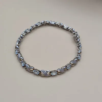 Sterling Silver Blue Topaz Infinity Link Tennis Bracelet