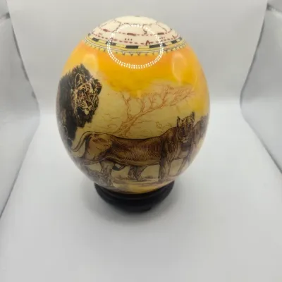 Decorative painted ostrich egg featuring an African safari scene 