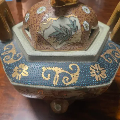 Satsuma ceramic koro (incense burner) featuring intricate hand-painted floral and bamboo motifs with gold gilt accents.