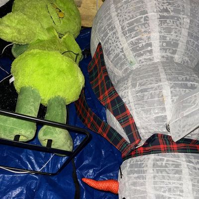 Sale Photo Thumbnail #44: Large plush Grinch figure and a collapsible snowman light-up outdoor Christmas decoration, both showing light wear.