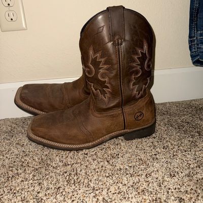 Sale Photo Thumbnail #23: Double H brown leather cowboy boots featuring decorative stitching on the shafts and square toes.