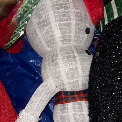 Sale Photo Thumbnail #45: Light-up wireframe snowman Christmas decoration with a snowflake pattern, red and green hat, and plaid scarf.