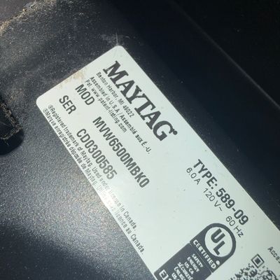 Sale Photo Thumbnail #6: Maytag appliance specification label showing model number MVW6500MBK0 and serial number CD0300585.