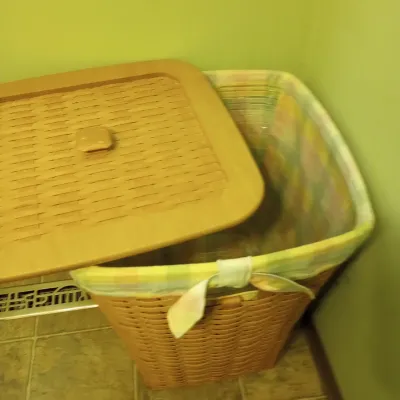 Sale Photo Thumbnail #8: Woven plastic laundry hamper with removable lid and pastel plaid fabric liner.