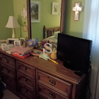 Sale Photo Thumbnail #51: Traditional dark wood nine-drawer dresser with an attached tall mirror and metal ring pulls.